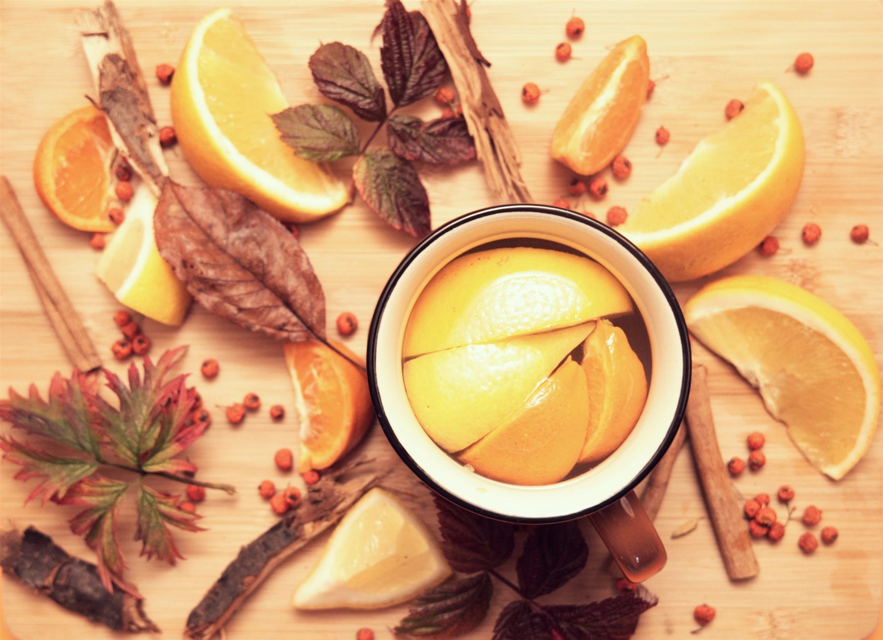 Warm still life of citrus fruit, leaves and spices